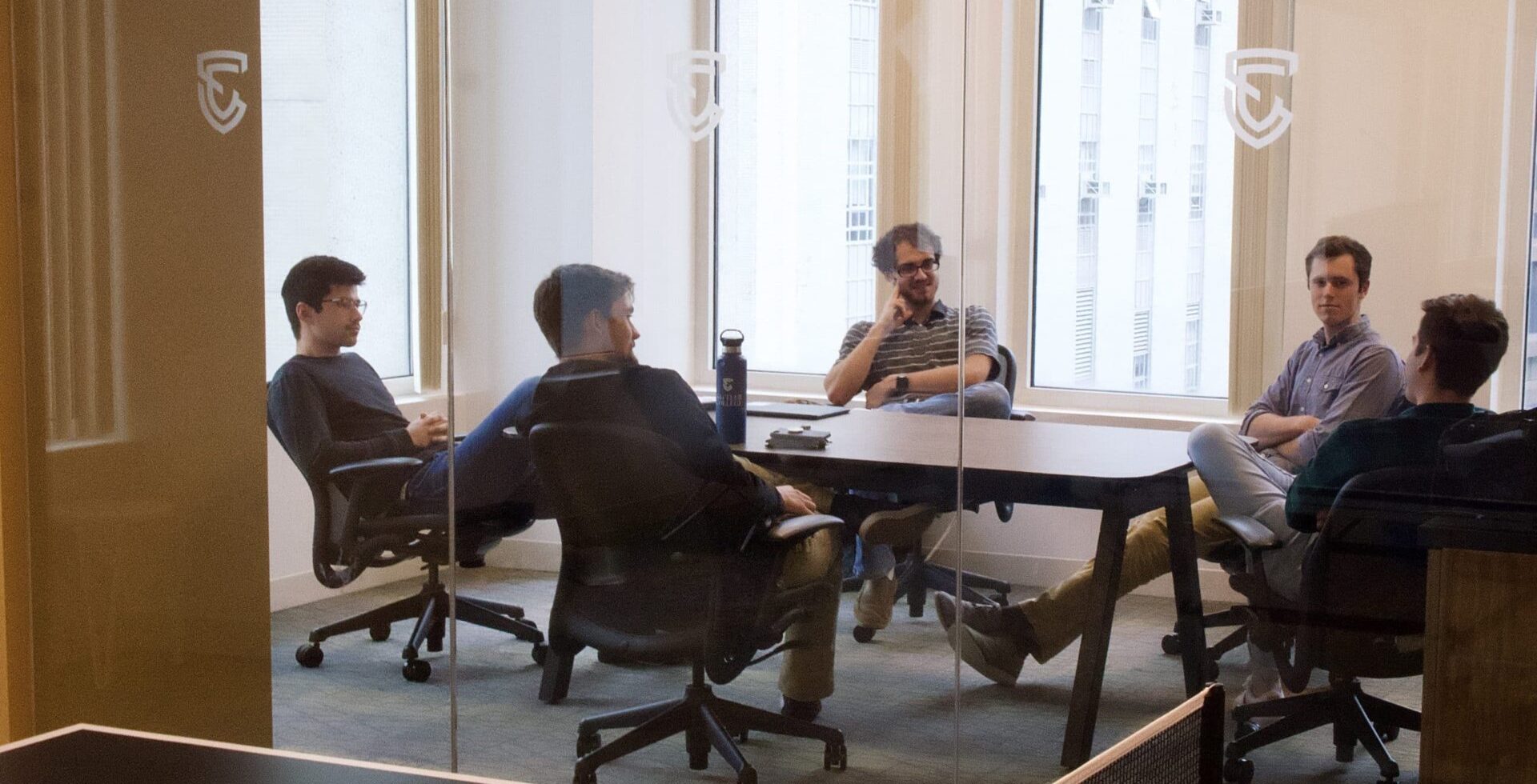 Five guys having a journey group meeting