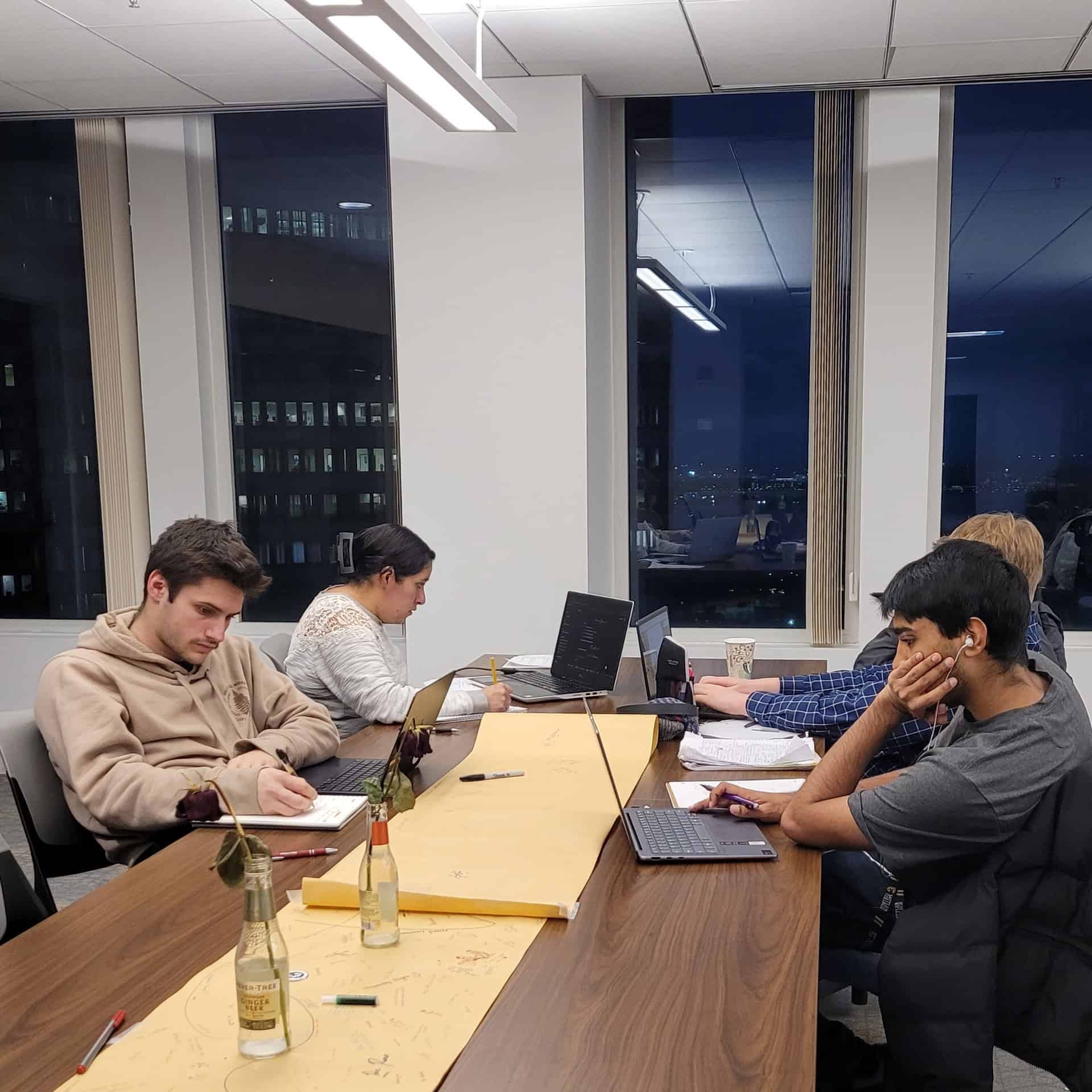 Students studying on campus in the evening