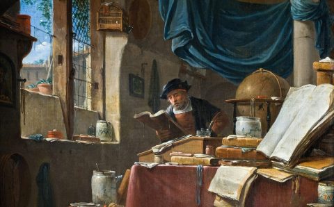 Medieval scholar studying manuscripts