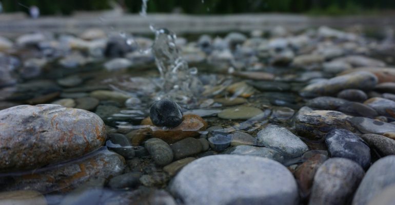 Water dripping on a stone, slowly changing it